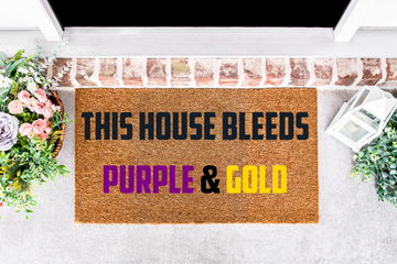 This House Bleeds Purple & Gold Doormat